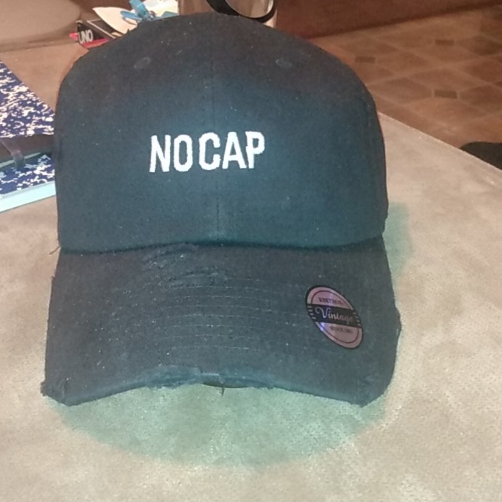 A custom black strap back cap OS